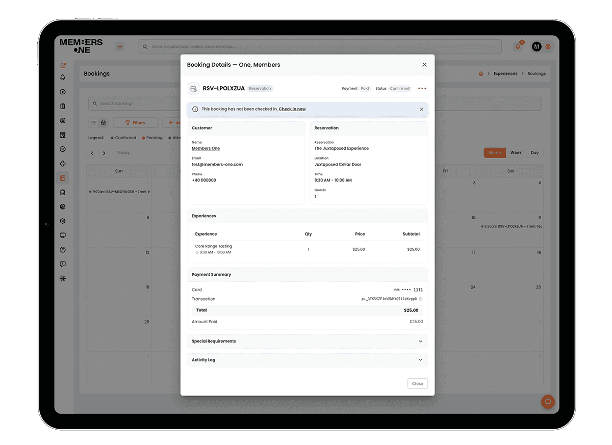 Booking details for a Core Range Tasting at Juxtaposed Cellar Door on an iPad, showing the guest, payment summary and a prompt to check them in, over the bookings calendar
